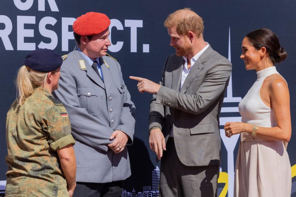 06 September 2022, North Rhine-Westphalia, Duesseldorf: Britain's Prince Harry (2nd from right), Duke of Sussex, and his wife Meghan, Duchess of Sussex (r), arrive in front of City Hall and talk to Sergeant Major Steffi Schenke (l) and to Lorraine Grosse-Frintrop, who has already been successful as an athlete at the Invictus Games in the past. The prince and his wife are coming to Düsseldorf to promote the "Invictus Games" 2023, which Prince Harry helped to launch. These are Paralympic competitions for soldiers who have been injured in war. Photo: Rolf Vennenbernd/dpa (Photo by Rolf Vennenbernd/picture alliance via Getty Images)