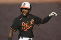 Baltimore Orioles' Cedric Mullins reacts after touching home after his home run during the first inning of the first baseball game of a doubleheader against the New York Yankees, Friday, Sept. 4, 2020, in Baltimore. (AP Photo/Nick Wass)