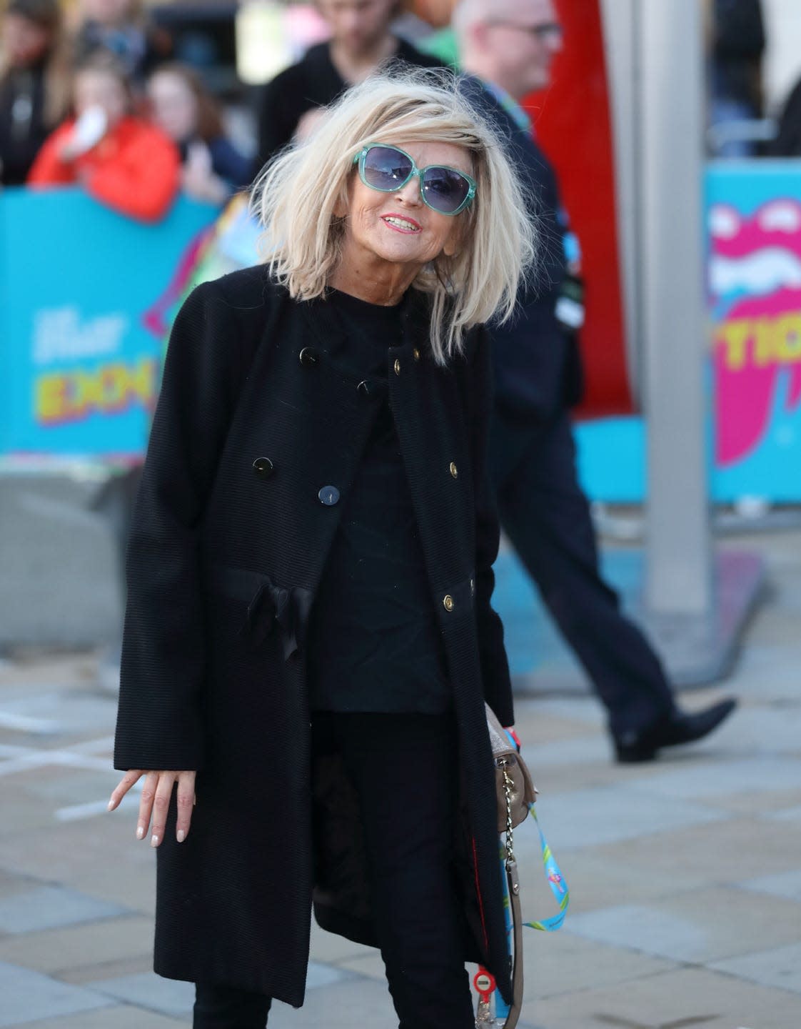 annie nightingale pictured walking down the street in london wearing sunglasses and smiling in 2016