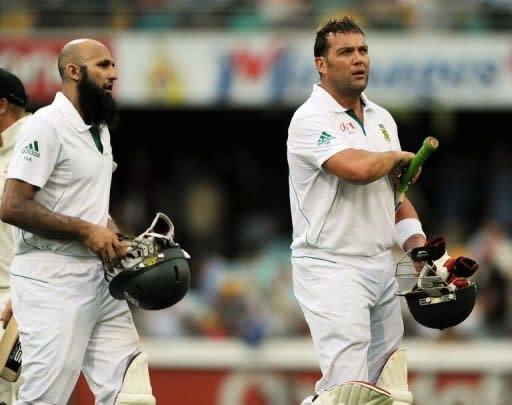 Hashim Amla (left) and Jacques Kallis (right) became South Africa's greatest scoring partnership as the Proteas dominated Australia's bowlers to seize control on day one of the first Brisbane Test on Friday