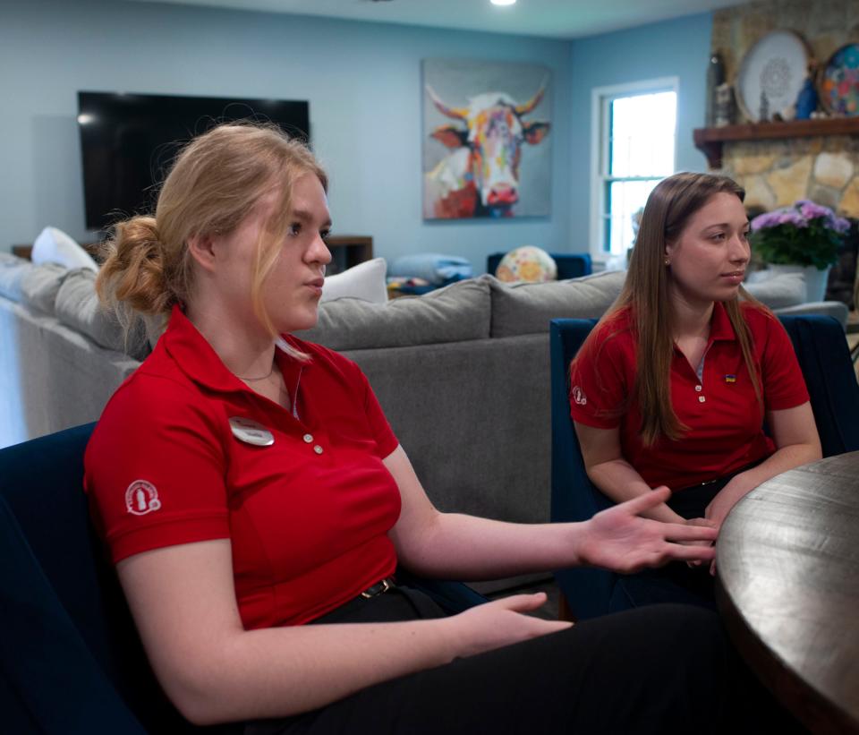 Mariia Kulyk (left) and Daria Meshcheriakova, Ukrainian college students living in Pensacola for the summer on a work-study program, discuss leaving their families behind in their war-stricken homeland on Friday, June 10, 2022.