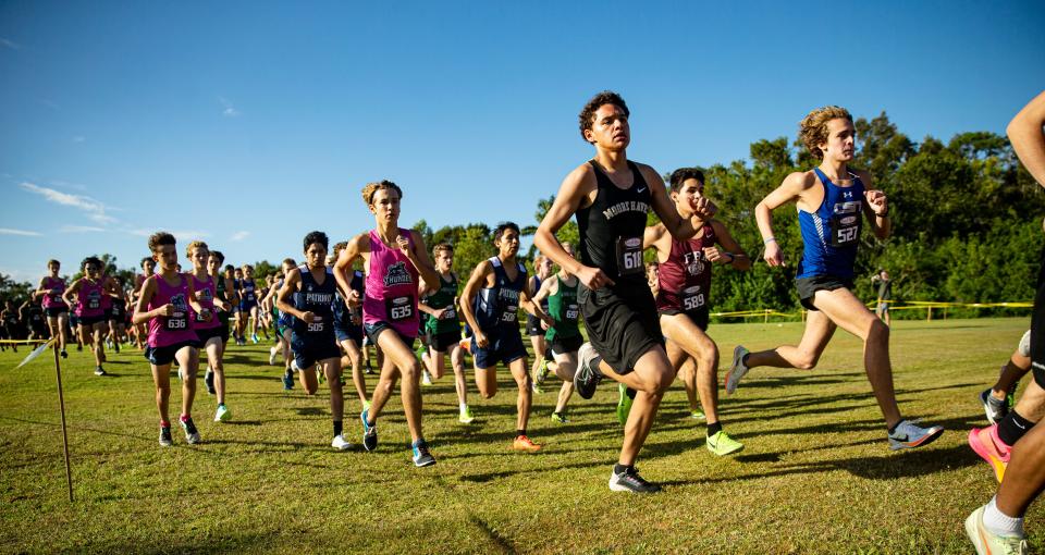 The boys participate in the FHSAA 1A District 6 Cross Country meet at Southwest Florida Christian Academy in Fort Myers on Thursday, Nov. 2, 2023. Tyler Mastrangelo, right front, from Community School of Naples won. Out of Door Academy from Sarasota won as a team.