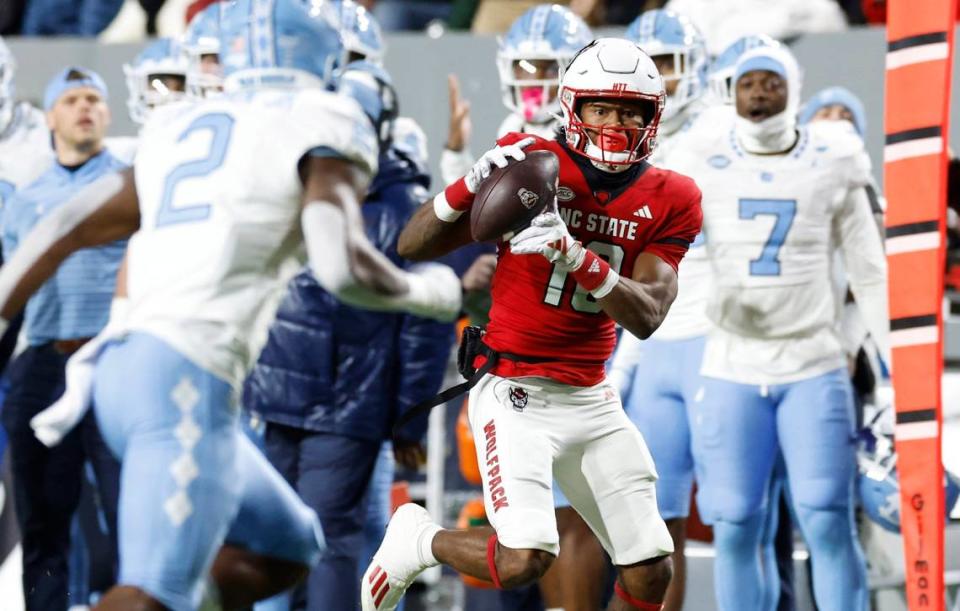 N.C. State wide receiver KC Concepcion (10) pulls in a reception during the first half of N.C. State’s game against UNC at Carter-Finley Stadium in Raleigh, N.C., Saturday, Nov. 25, 2023.