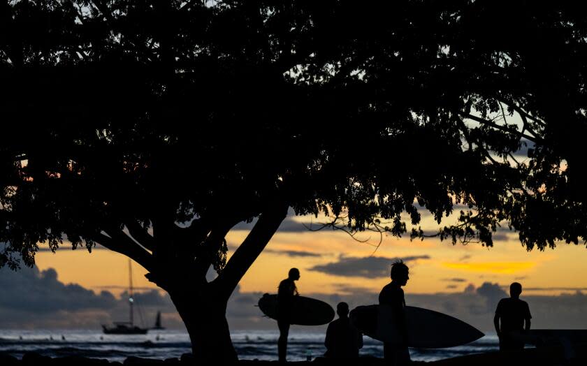 HONOLULU, HI - OCTOBER 22: at Kahanamoku Beach in Waikiki on the southern shore of the island of Oahu on Thursday, Oct. 22, 2020 in Honolulu, HI. Amid the ongoing Coronavirus pandemic, the State of Hawaii is trying to restart its tourism economy; October 15 was the start of a new traveler testing program, with thousands of people expected to arrive to the state. (Kent Nishimura / Los Angeles Times)
