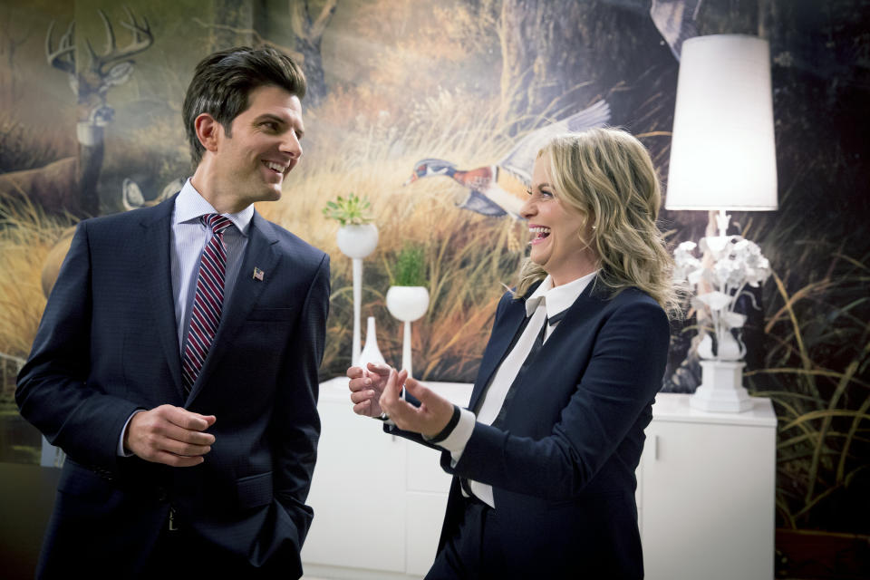 PARKS AND RECREATION -- "One Last Ride" Episode 712/713 -- Pictured: (l-r) Adam Scott as Ben Wyatt, Amy Poehler as Leslie Knope -- (Photo by: Paul Drinkwater/NBCU Photo Bank/NBCUniversal via Getty Images via Getty Images)