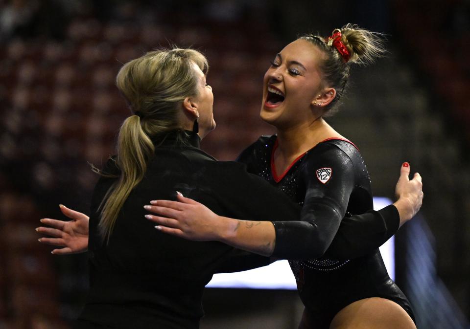 Utah’s Makenna Smith celebrates after her Beam routine as BYU, Utah, SUU and Utah State meet in the Rio Tinto Best of Utah Gymnastics competition at the Maverick Center in West Valley City on Monday, Jan. 15, 2024. | Scott G Winterton, Deseret News