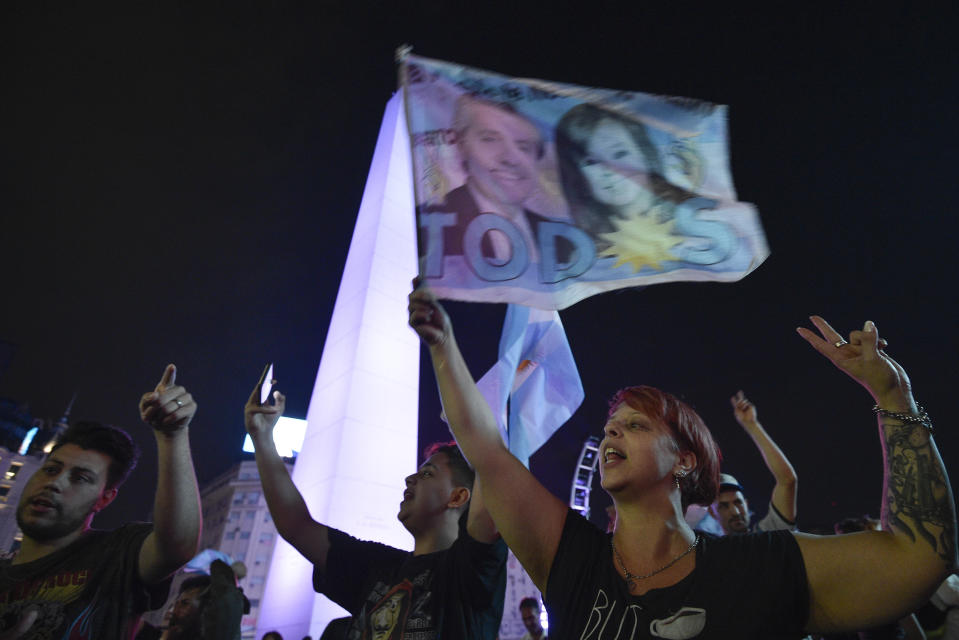 Supporters of Peronist presidential candidate Alberto Fernández and running mate, former President Cristina Fernández, celebrate after incumbent President Mauricio Macri conceded defeat at the end of election day at the Obelisk in Buenos Aires, Argentina, Sunday, Oct. 27, 2019. (AP Photo/Gustavo Garello)