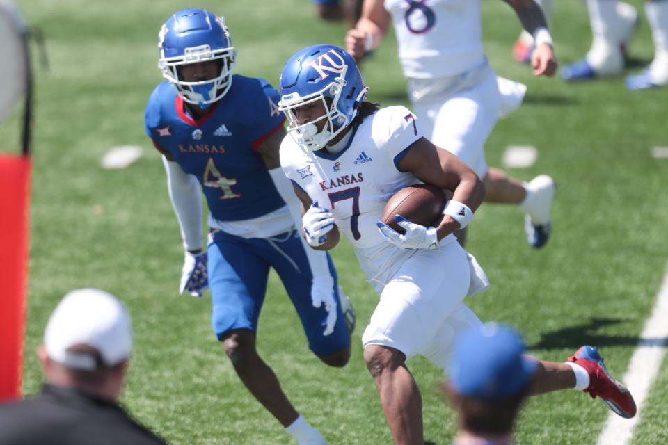 Kansas redshirt junior wide receiver Trevor Wilson (7) runs with the ball during the team's spring game earlier this year at David Booth Kansas Memorial Stadium.