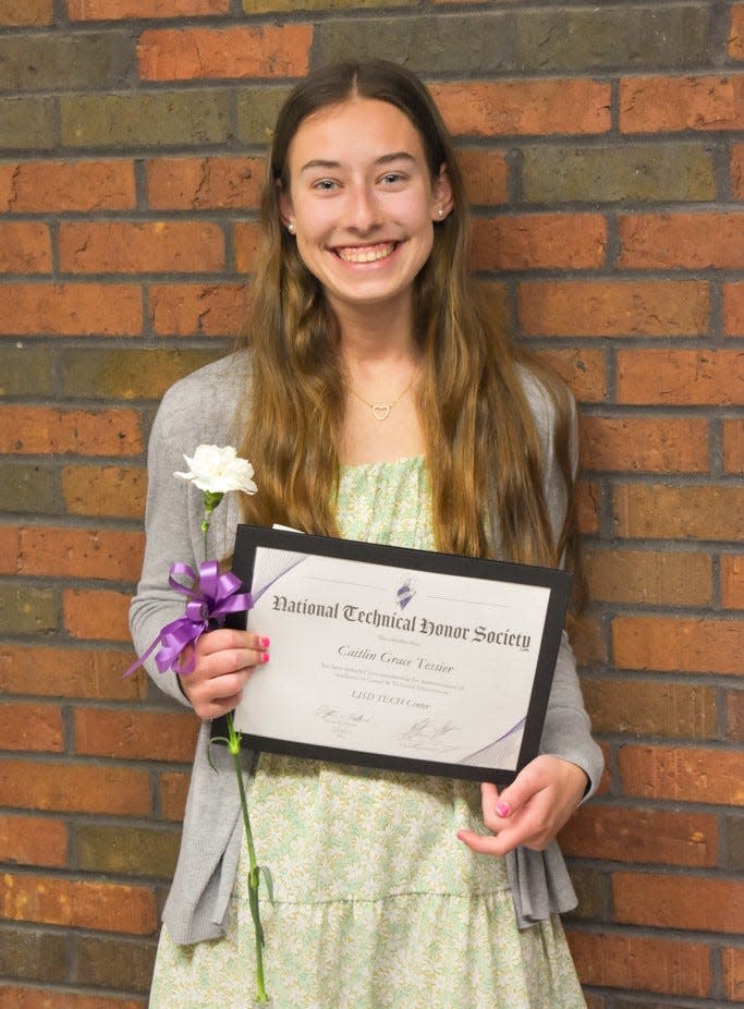 Caitlin Tessier, an Onsted High School junior, smiles after being inducted into the Lenawee Intermediate School District's chapter of the National Technical Honor Society April 6.
