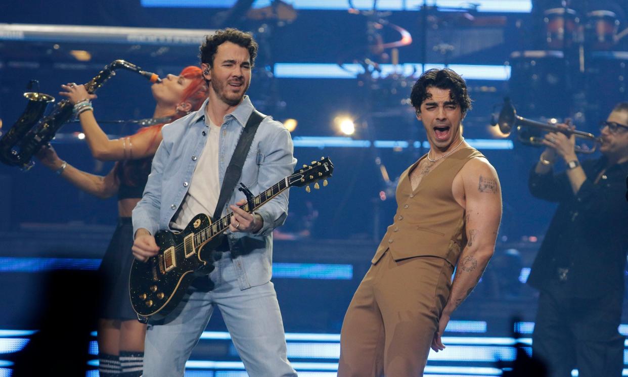 Kevin (left) and Joe Jonas perform Dec. 6 at the Prudential Center in Newark.