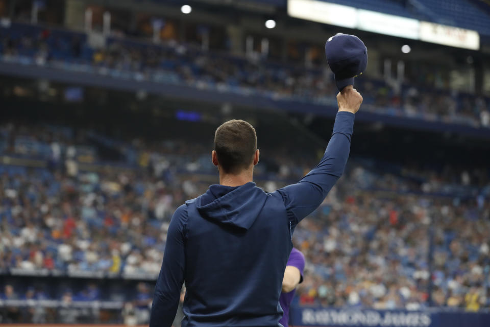 Tampa Bay Rays' Kevin Kiermaier gestures to fans after a video tribute to him, during the second inning of the team's baseball game against the Toronto Blue Jays on Saturday, Sept. 24, 2022, in St. Petersburg, Fla. Kiermaier is out for the season. (AP Photo/Scott Audette)