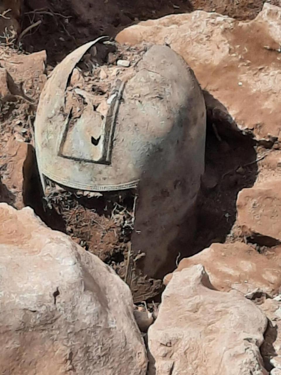 The 2,500-year-old Greek-Illyrian helmet while still partially buried.