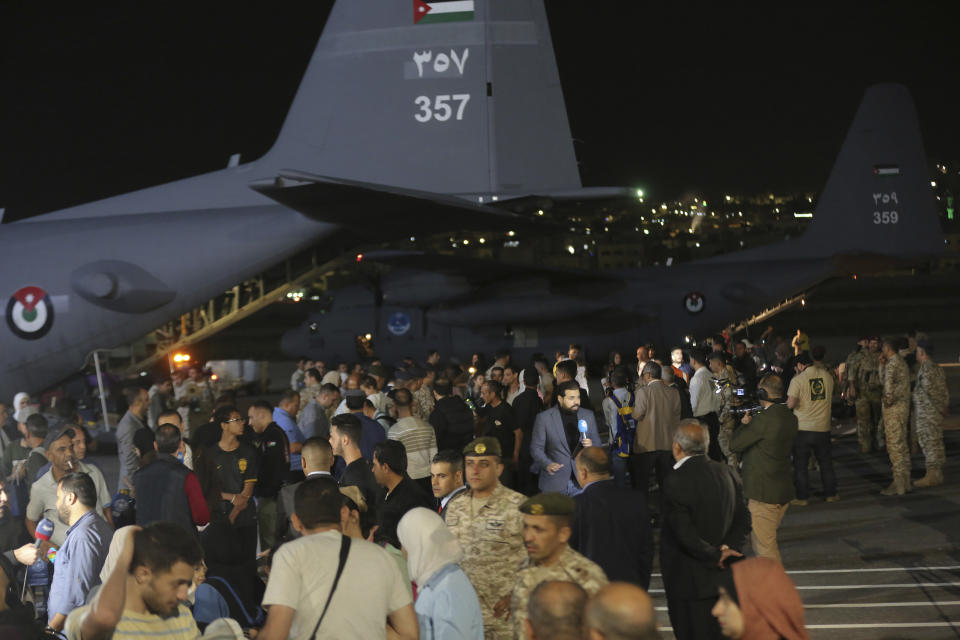 Jordanians evacuated form Sudan arrive to a military airport in Amman, Jordan, Monday, April 24, 2023. (AP Photo/Raad Adayleh)