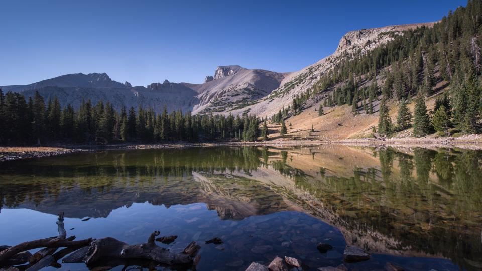 the annular solar eclipse will be visible from the Great Basin National Park, Nevada. Photographed here is Lake Stella , reflecting the sky and large rocky outcrops in the still water.