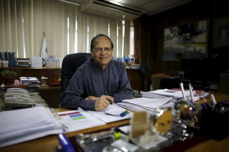 Bangladesh's central bank governor Atiur Rahman poses inside his office in Dhaka in this October 2, 2013 file photo. REUTERS/Andrew Biraj/Files