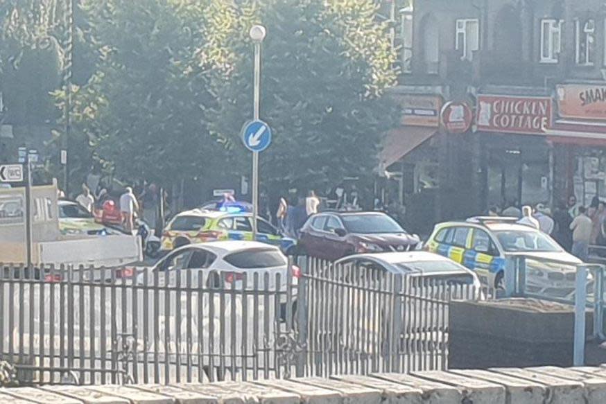 Armed police swarmed the area near Chicken Cottage outside Rayners Lane station on Tuesday (Twitter/@S_Kavinthan)