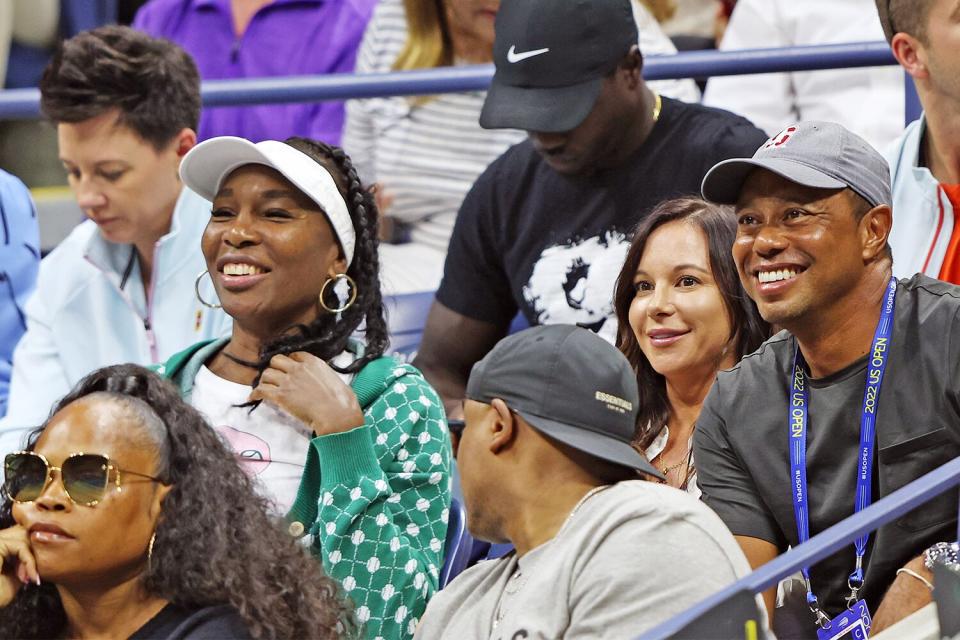 NEW YORK, NEW YORK - AUGUST 31: Venus Williams, Erica Herman and Tiger Woods look on during the Women's Singles Second Round match between Anett Kontaveit of Estonia and Serena Williams of the United States on Day Three of the 2022 US Open at USTA Billie Jean King National Tennis Center on August 31, 2022 in the Flushing neighborhood of the Queens borough of New York City. (Photo by Jamie Squire/Getty Images)