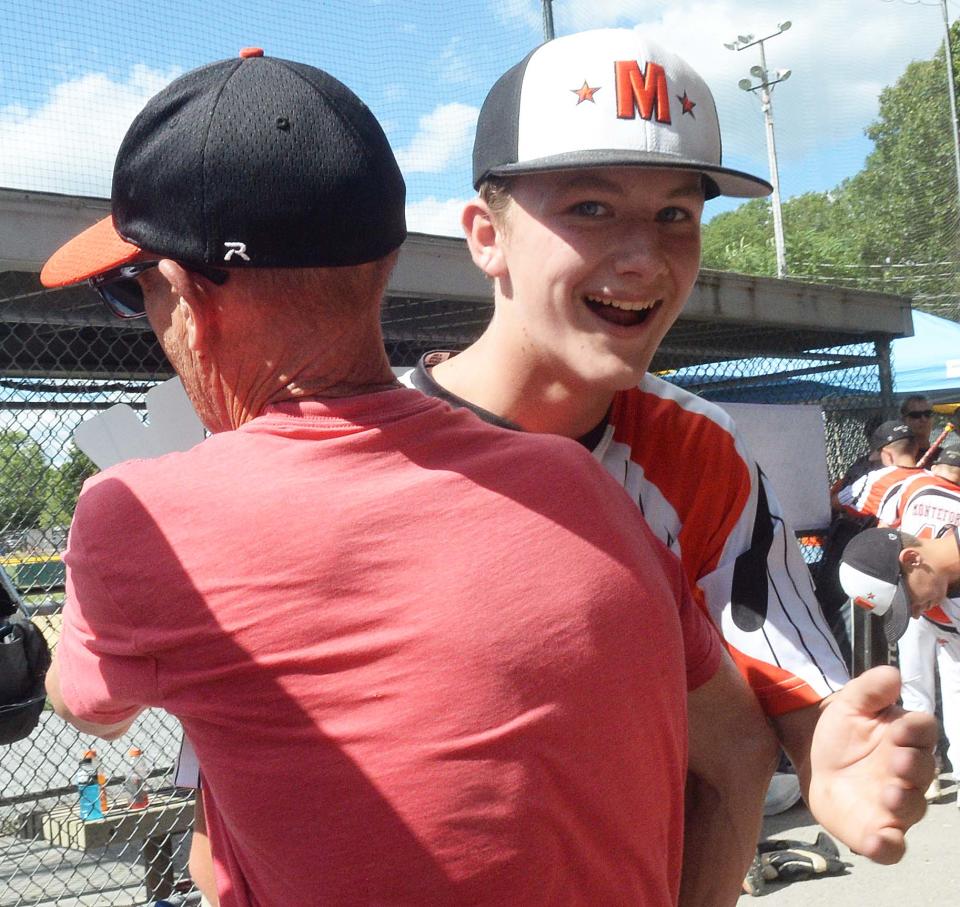 Middleboro 12U Nationals Jayden Murphy is congratulated by Skeeter Porter at the conclusion of their game versus Pittsfield at Dunn Little League Complex at Hollingsworth Park in Braintree on Saturday, July 30, 2022.  