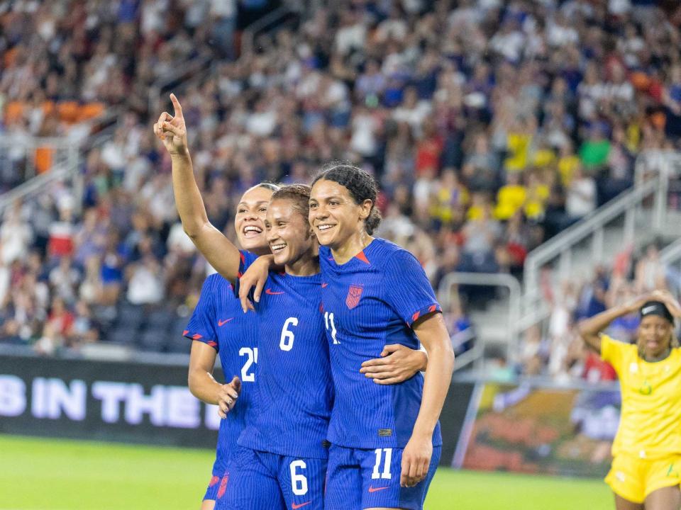 Lynn Williams (center) celebrates with teammates after scoring a goal during a September friendly with the USWNT.