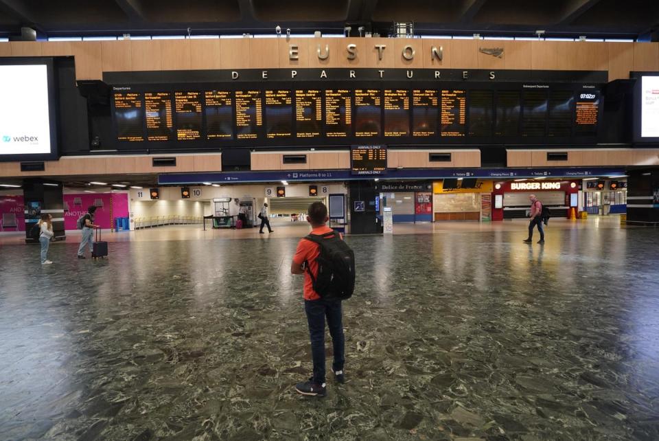 Passengers at Euston station in London on Tuesday (Stefan Rousseau/PA) (PA Wire)