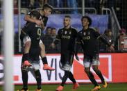 Football Soccer - Frosinone v Juventus Serie A - Matusa Stadium, Frosinone, Italy - 07/02/16. Juventus' Paulo Dybala (top L) celebrates with his team mates after scoring against Frosinone. REUTERS/Max Rossi