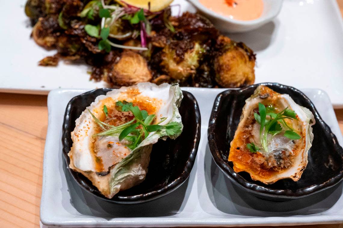 Oysters on the half shell and other appetizers sit ready to be served at Kru Contemporary Japanese Cuisine on Friday.