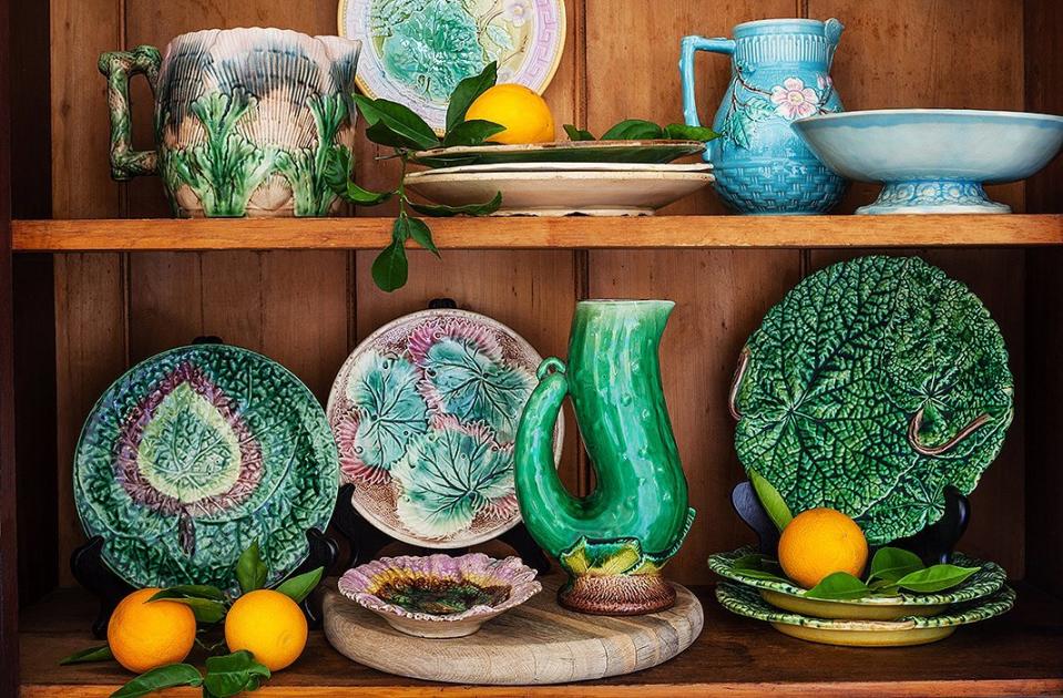 Elegant majolica pottery display inside a home.