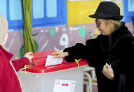 A Tunisian votes in the second round of the legislative elections in Tunis, Sunday, Jan. 29, 2023. Tunisia's president and its shaky democracy are facing an important test Sunday as voters cast ballots in the second round of parliamentary elections. Turnout was just 11% in the first round of voting last month. (AP Photo/Hassene Dridi)