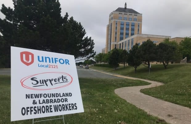 Unifor, which represents workers in the Terra Nova oilfield, rallies outside Confederation Building on Monday as an emergency debate is held in the House of Assembly. (Terry Roberts/CBC - image credit)
