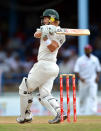 Batsman Shane Watson of Australia hits a four during the first day of the second-of-three Test matches between Australia and West Indies April 15, 2012 at Queen's Park Oval in Port of Spain, Trinidad. AFP PHOTO/Stan HONDA