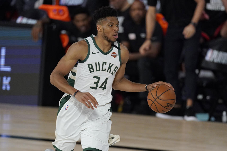 Milwaukee Bucks' Giannis Antetokounmpo (34) in the second half of an NBA conference semifinal playoff basketball game against the Miami Heat Friday, Sept. 4, 2020, in Lake Buena Vista, Fla. (AP Photo/Mark J. Terrill)