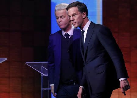 Dutch far-right politician Geert Wilders of the PVV party and Dutch Prime Minister Mark Rutte (R) of the VVD Liberal party take part in the "EenVandaag" debate in Rotterdam, Netherlands, March 13, 2017. REUTERS/Yves Herman