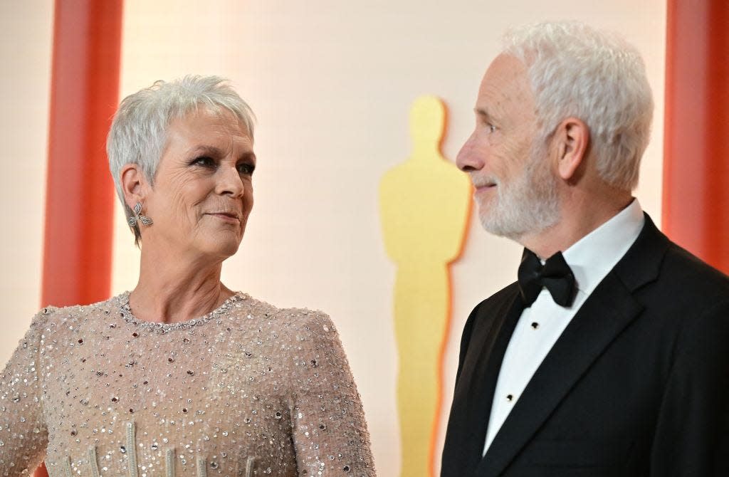 Jamie Lee Curtis and her husband, Christopher Guest, attending the 95th Academy Awards.