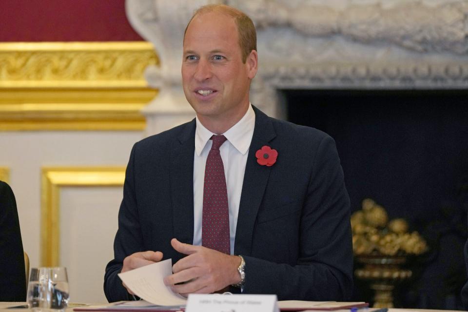 Prince William, Prince of Wales (2ndR) speaks with guests as he attends a Tusk Conservation symposium at St James's Palace