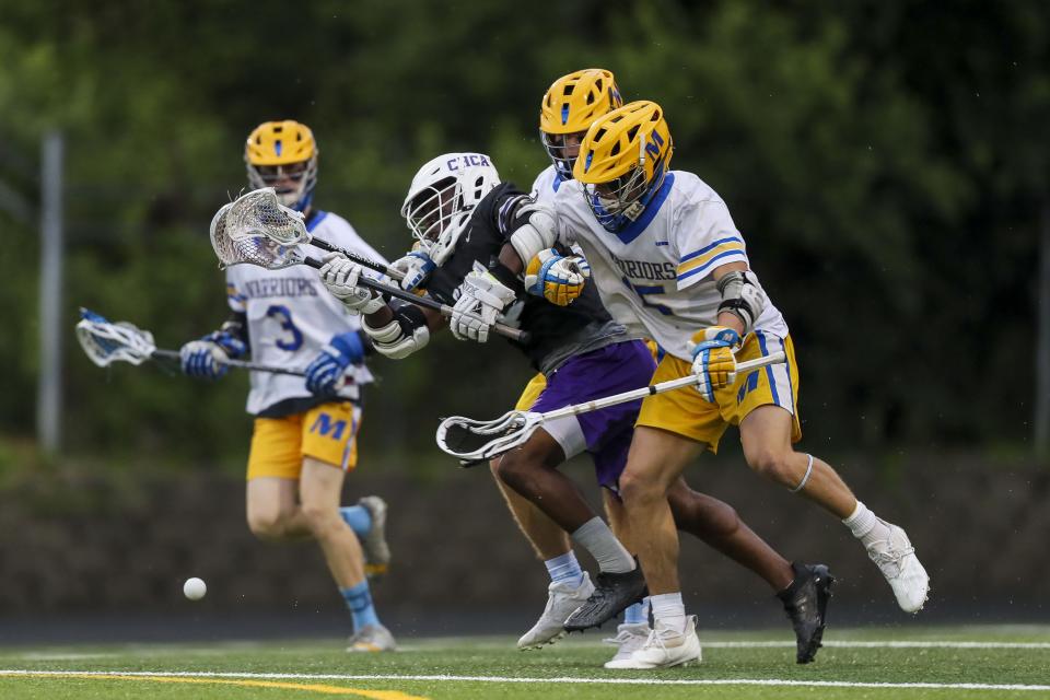 Mariemont attack Max Tepe (15) battles for the ball against Cincinnati Hills Christian Academy midfielder Wilbur Wiggins (6) in the first half at Mariemont High School May 26, 2022.