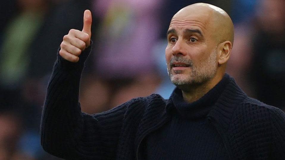 Pep Guardiola gives a thumbs up