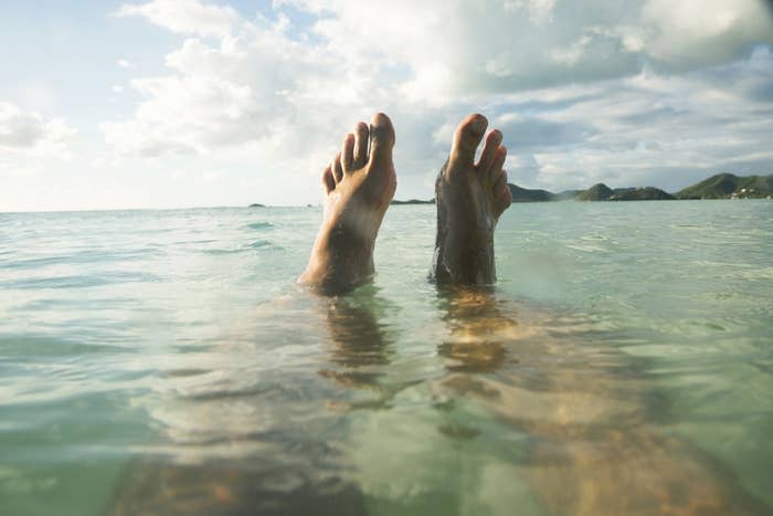 feet sticking out of water