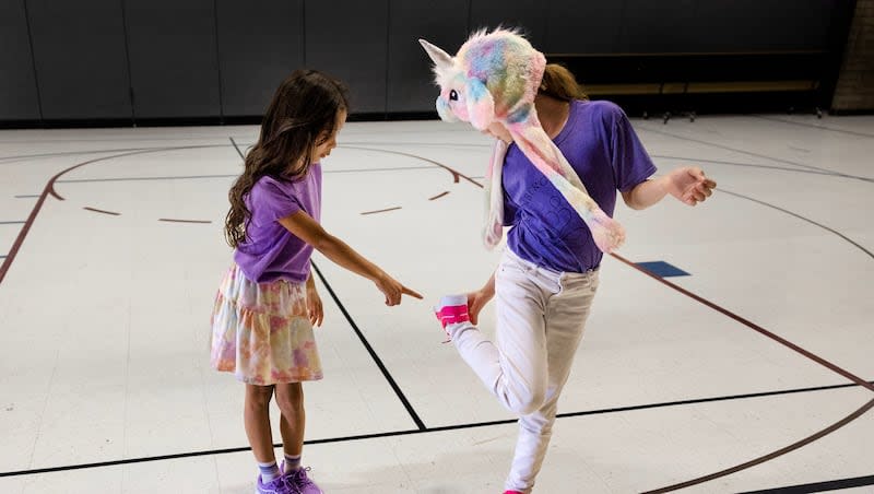 Gabriela Echeverria, left, admires Kaydence Crook’s new running shoes at Mary W. Jackson Elementary School in Salt Lake City on Thursday, April 18, 2024. Mark Miller Subaru and University of Utah Health Plans donated new running shoes to Girls on the Run Utah for its spring afterschool program. Girls on the Run introduces running to girls of all skill levels while inspiring confidence and healthy habits that last a lifetime. This spring, Girls on the Run Utah is serving more than 1,400 third-eighth grade girls at over 100 sites.