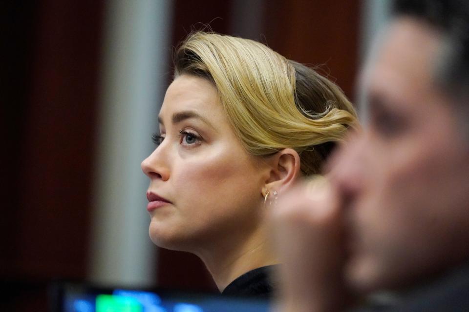 Actress Amber Heard listens in the courtroom at the Fairfax County Circuit Courthouse in Fairfax, Virginia, on April 25, 2022.