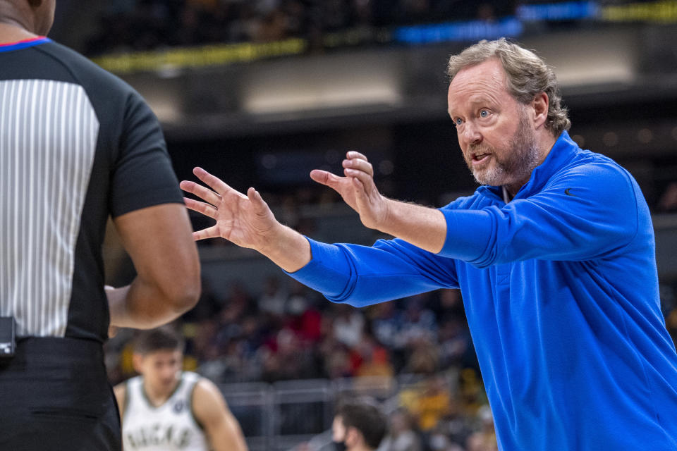 Milwaukee Bucks head coach Mike Budenholzer reacts towards a game official during the first half of an NBA basketball game against the Indiana Pacers in Indianapolis, Sunday, Nov. 28, 2021. (AP Photo/Doug McSchooler)