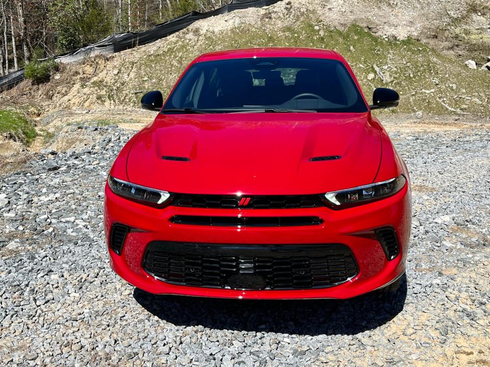 The 2024 Dodge Hornet R/T compact SUV's hood, lights and grille recall the Dodge Charger sedan