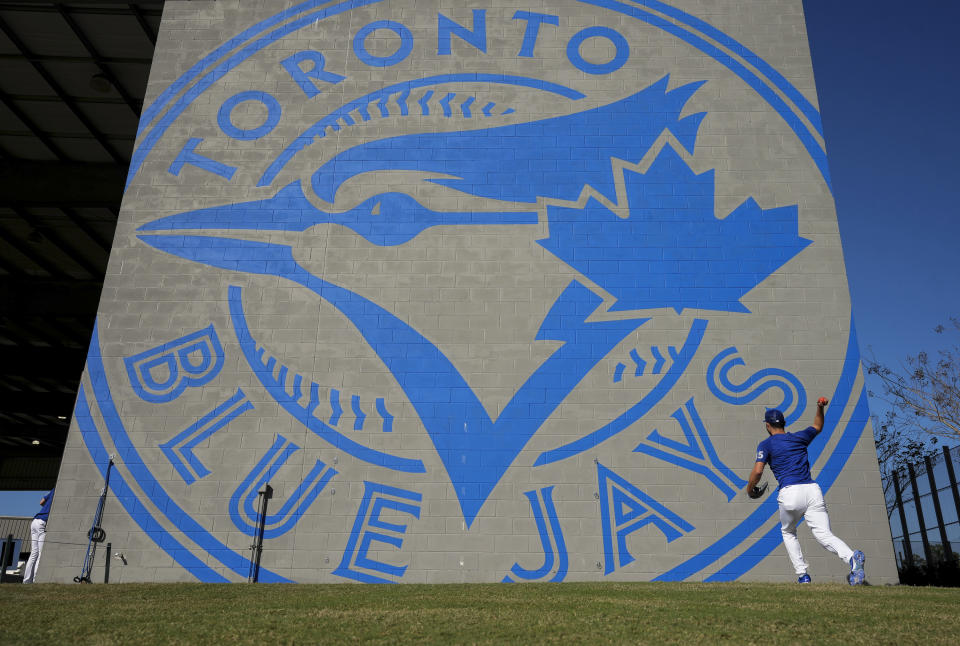 Toronto Blue Jays pitcher Mitch White warms his arm up during baseball spring training in Dunedin, Fla., Wednesday, Feb. 22, 2023.(Nathan Denette/The Canadian Press via AP)