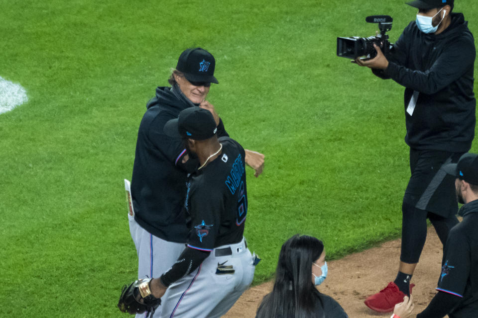 Miami Marlins manager Don Mattingly celebrates with the team in clinching a playoff berth after their win in the 10th inning of a baseball game against the New York Yankees at Yankee Stadium, Friday, Sept. 25, 2020, in New York. (AP Photo/Corey Sipkin)