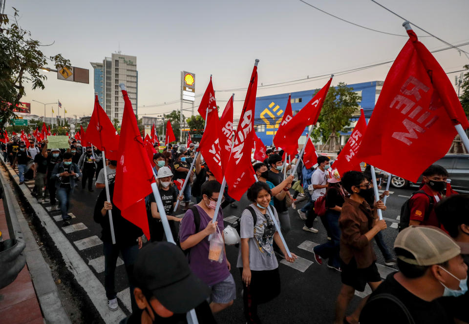 Anti-government protesters march to the criminal court during a protest in Bangkok, Thailand, Saturday, March 6, 2021. A new faction of Thailand's student-led anti-government movement calling itself REDEM, short for Restart Democracy, announced plans to march to Bangkok's Criminal Court Saturday to highlight the plight of several detained leaders of the protest movement. (AP Photo/Sakchai Lalit)