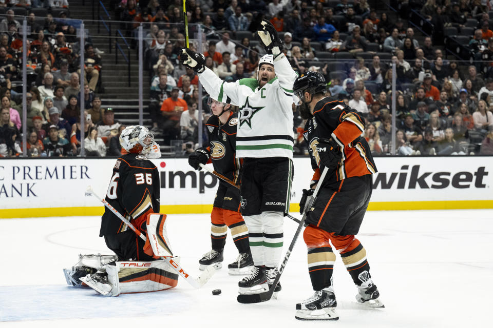 Dallas Stars left wing Jamie Benn, center, reacts after a goal by center Joe Pavelski (not shown) during the second period of an NHL hockey game against the Anaheim Ducks, Thursday, Oct. 19, 2023, in Anaheim, Calif. (AP Photo/Kyusung Gong)