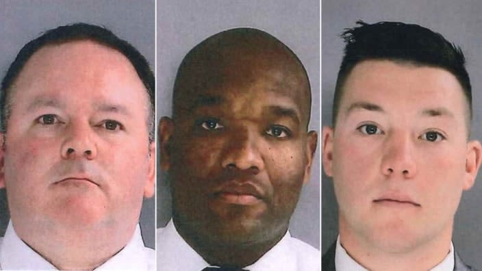 In this photo provided by the Delaware County, Pa., District Attorney’s Office on Jan. 18, 2022, Sharon Hill Police Officers Brian Devaney, left, Sean Dolan and Devon Smith are shown. (Delaware County District Attorney’s Office vis AP, File)