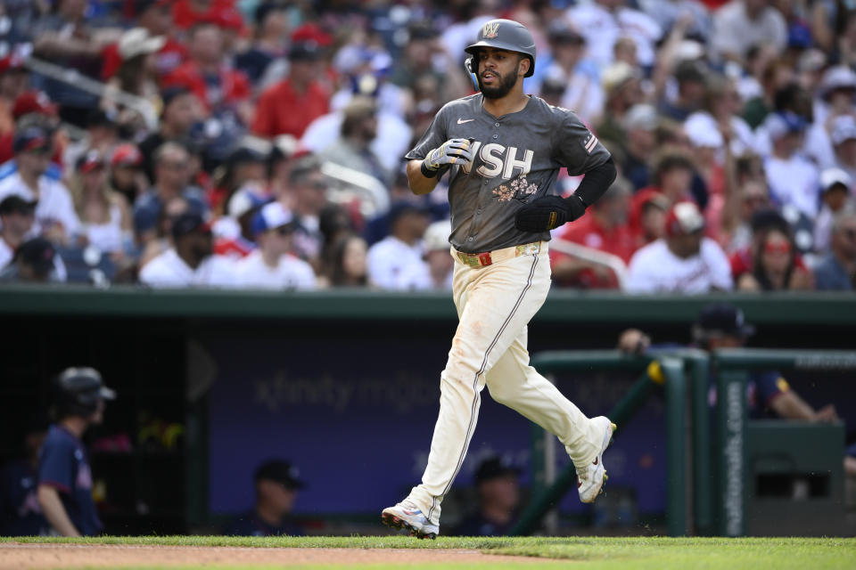 Washington Nationals' Luis Garcia Jr. runs towards home to score on a double by Nick Senzel during the fourth inning of a baseball game against the Atlanta Braves, Saturday, June 8, 2024, in Washington. (AP Photo/Nick Wass)wld