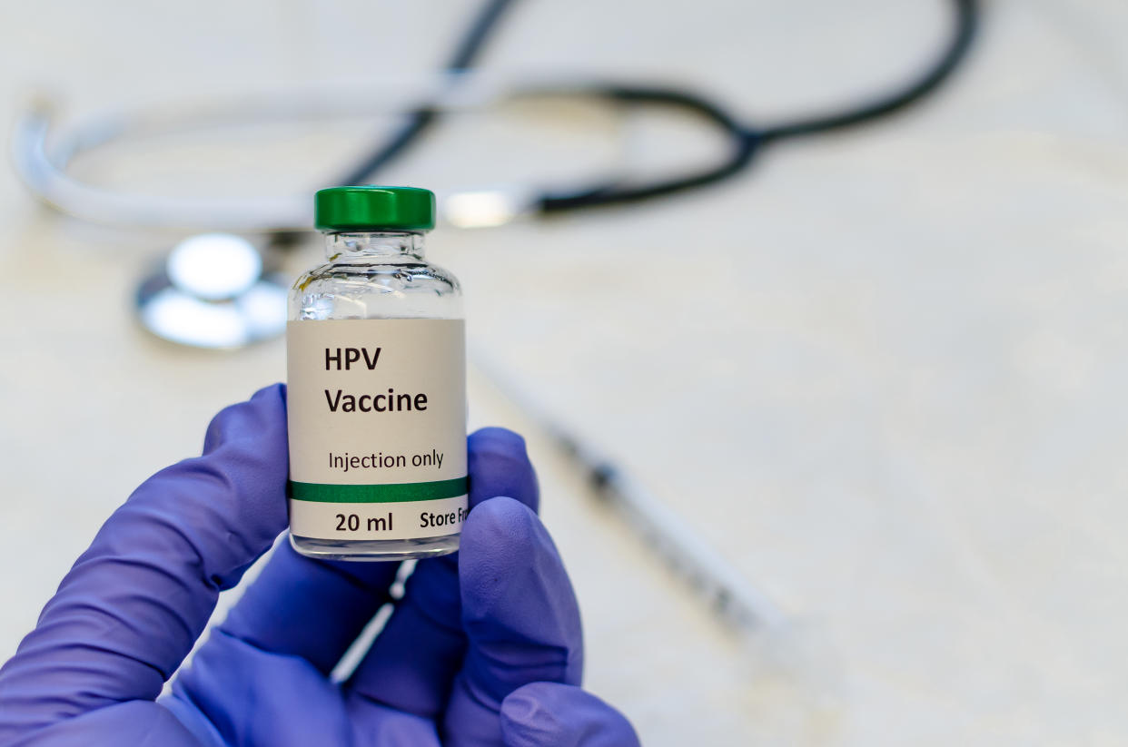 Fake HPV vaccine vial holding in hand