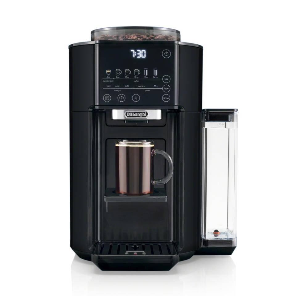 De'Longhi TrueBrew Drip Coffee Maker with cup of black coffee and whole coffee beans (Photo via De'Longhi)