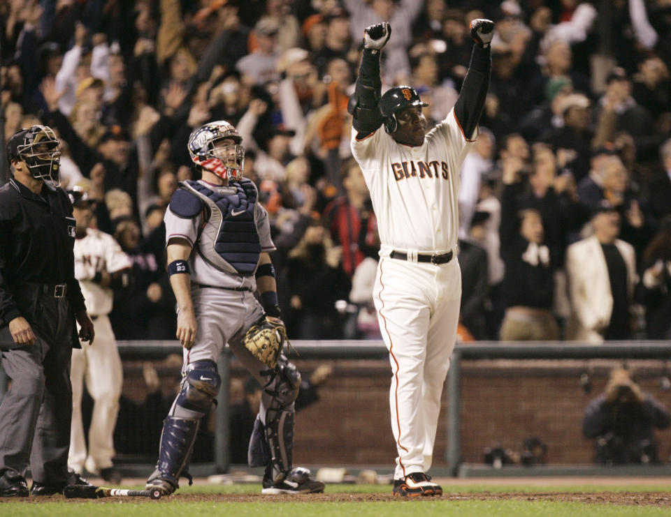 FILE - San Francisco Giants' Barry Bonds celebrates after hitting his 756th career home run against the Washington Nationals during the fifth inning of their baseball game in San Francisco, on Aug. 7, 2007. Barry Bonds, Roger Clemens and David Ortiz appear to be the only players with a chance at Hall of Fame enshrinement when results are unveiled Tuesday, Jan. 25, 2022, with Ortiz most likely to get in on his first try. Bonds and Clemens are each in their 10th and final turns under consideration by voters from the Baseball Writers' Association of America. (AP Photo/Eric Risberg, file)